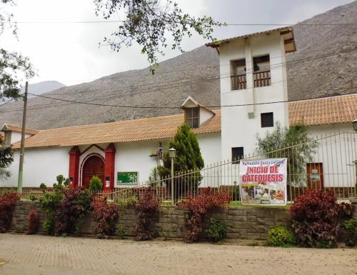 a large white building with a sign in front of it at Casa de Campo en Santa Eulalia in Santa Eulalia