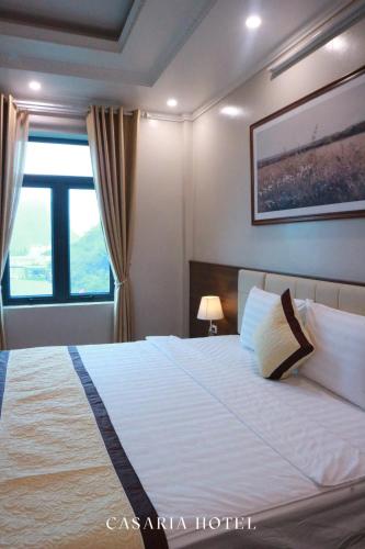Ένα ή περισσότερα κρεβάτια σε δωμάτιο στο Casaria Hotel