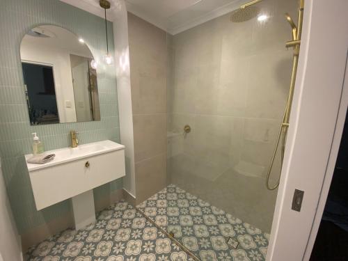 a bathroom with a sink and a shower at #75 at IVORY Unique modern space with the extras in Noosaville