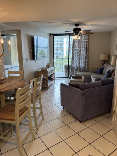 a living room with a couch and a table at Gulf Shores Surf and Racquet Club Unit 406C in Gulf Shores