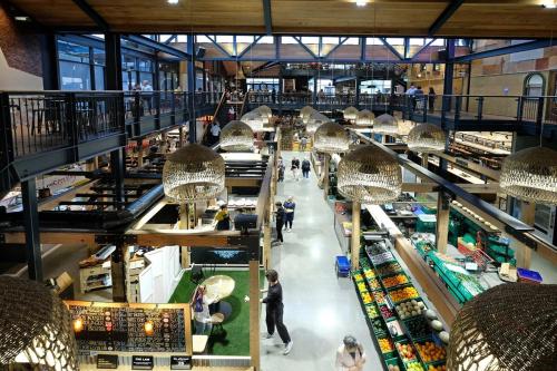 an overhead view of a shopping mall with people walking around at Heart of the City Stay - With the Best Coffee! in Christchurch