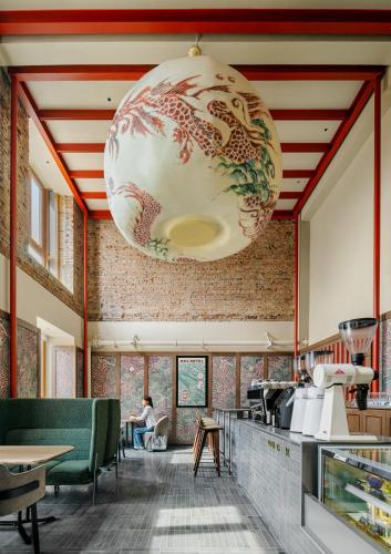 a large chandelier hanging from the ceiling of a kitchen at NOA HOTEL BEIJING LONGFU-The Forbidden City in Beijing