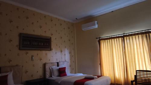 Letto o letti in una camera di edOTEL K-One Mandalika 002