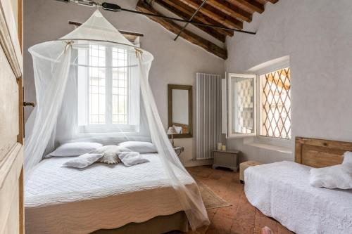 En eller flere senge i et værelse på Casa Di Laura