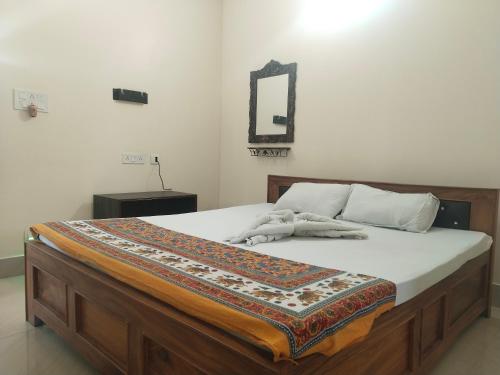 Ένα ή περισσότερα κρεβάτια σε δωμάτιο στο Udita Homestay Prayas