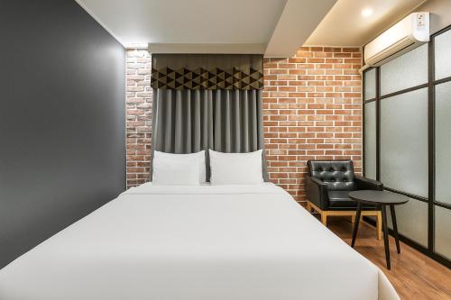 Ein Bett oder Betten in einem Zimmer der Unterkunft Hotel Lin