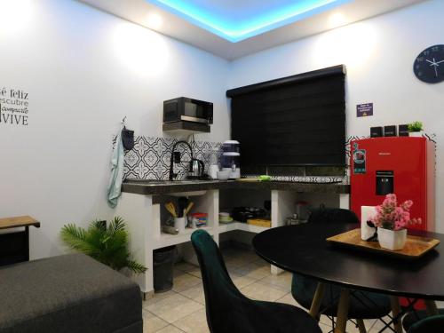 a living room with a table and a tv at Depa privado Estadio GNP -Foro Sol-, Palacio de los Deportes in Mexico City