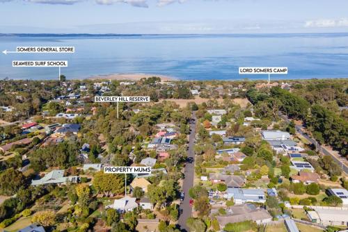 an aerial view of a suburb with houses and the water at Sky Views in Somers