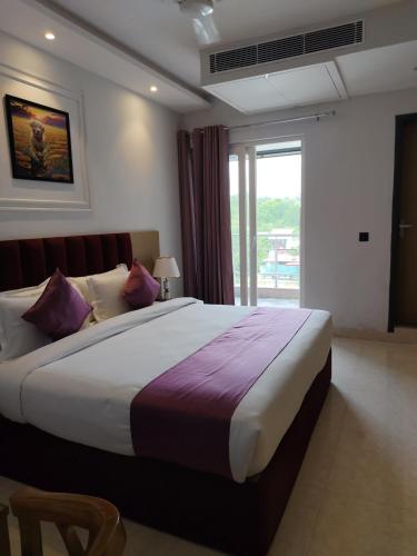 Postel nebo postele na pokoji v ubytování Hotel Journee