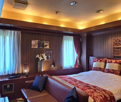 Postel nebo postele na pokoji v ubytování ホテルイエロー所沢