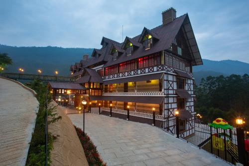 a large building with lights in front of it at Koviloor Resort in Vattavada