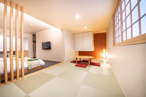 a bedroom with a bed and a table in a room at Hotel Naranohamori in Nara