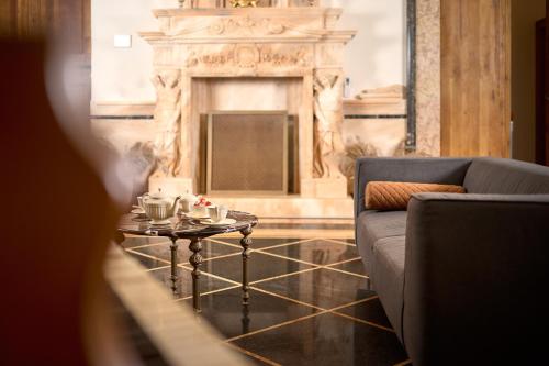 a living room with a couch and a coffee table at Palazo dei CONTI in Split Centre OLD town in Split