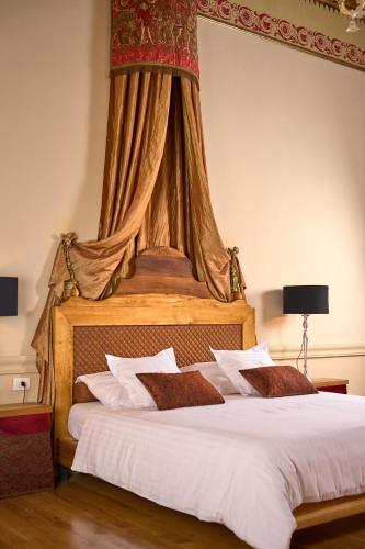 a bedroom with a large bed with a canopy at Palazo dei CONTI in Split Centre OLD town in Split