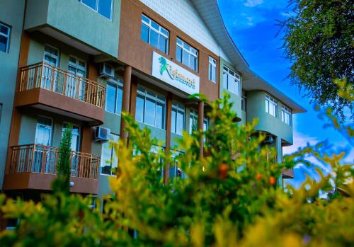 a building with a sign on the side of it at KISIMANI ECO RESORT & SPA LTD in Isiolo