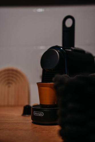a coffee cup sitting on top of a table at Aprießnig Apartments in Fürnitz