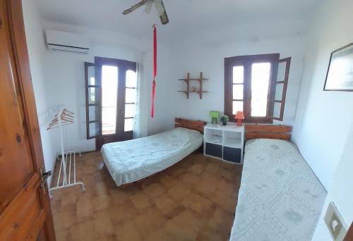 Postel nebo postele na pokoji v ubytování Costa Mama VIlla