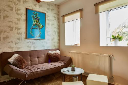a living room with a couch and a table at Luxury house in Krkonoše - Bukanda in Mladé Buky