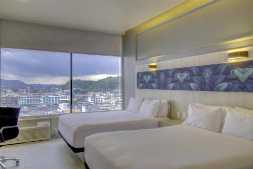 Postel nebo postele na pokoji v ubytování DoubleTree by Hilton Guayaquil