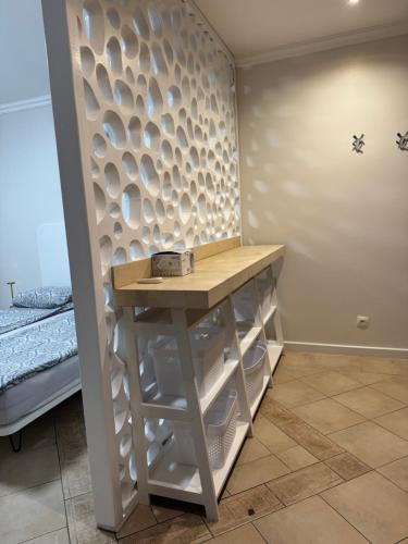 a room with a small table and a bed at Santa Marina Apartment 513 in Sozopol