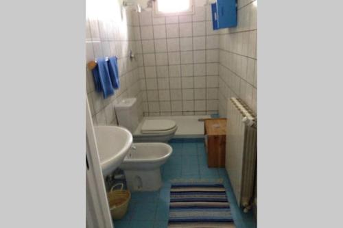 a bathroom with a toilet and a sink at HouseLake and Garden - Pescate - Lecco in Galbiate