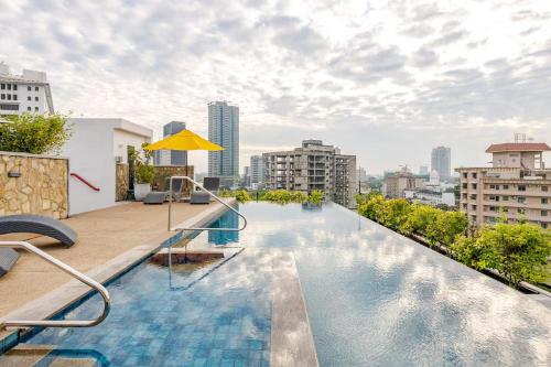 a swimming pool on the roof of a building at VAUX Park Street Hotel - A collection of 8 luxury lofts in Colombo