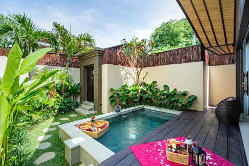 a pool in the backyard of a house at Villa Dijabu in Kuta
