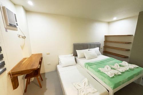 Ένα ή περισσότερα κρεβάτια σε δωμάτιο στο Accessline Inn Boracay powered by Cocotel