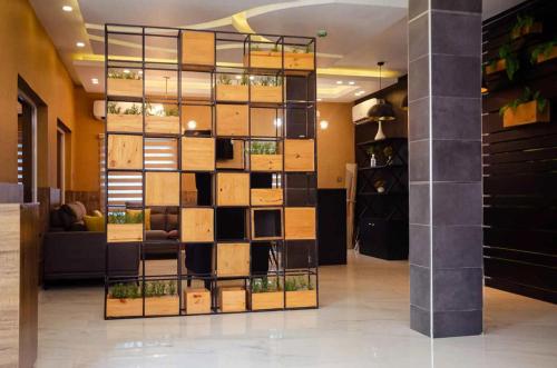 a wall of cardboard boxes in a room at Ibizza Pit Hotel and Suites in Bolorunpelu