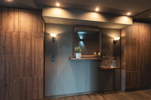 a bathroom with a sink and a mirror at Naturhotel Sachsenbaude Oberwiesenthal - Indoor-Pool & Outdoor-Whirlpool in Kurort Oberwiesenthal