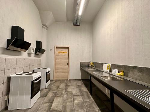 Η κουζίνα ή μικρή κουζίνα στο GPHotel/Boardinghaus