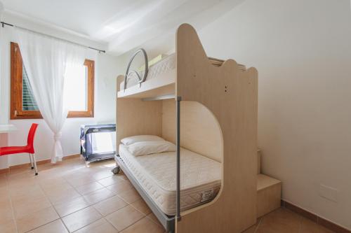 Ένα ή περισσότερα κρεβάτια σε δωμάτιο στο Dépandance HP