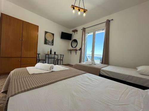 Katil atau katil-katil dalam bilik di Ostria Sea View Suite