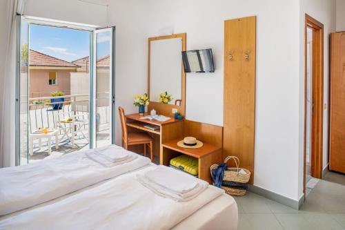 Hotel Tritoneにあるベッド