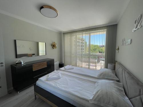 Postel nebo postele na pokoji v ubytování ApartComplex Splendid