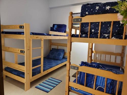 Postel nebo postele na pokoji v ubytování 蘭嶼夏一棧民宿XYZ Inn