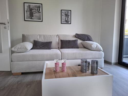 a living room with a couch and a coffee table at FeWo kleine Auszeit Höxter in Höxter