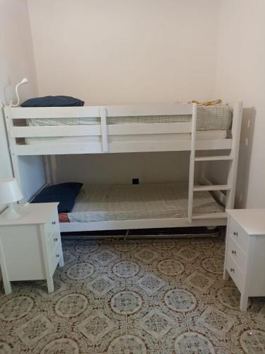 a white bunk bed in a room at Casa Agrumeto in Nunziata in Nunziata