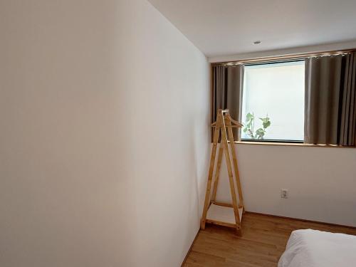 a room with a ladder and a wall with a window at Mangwon Hangang Park House 3 rooms or one room in Seoul