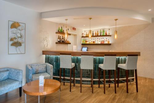 a bar in a restaurant with chairs and a table at Hotel Marina Rio in Lagos