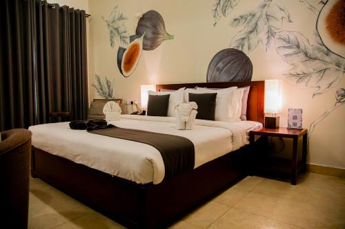 a bedroom with a large bed in a room at Morven Hotel Colombo in Colombo