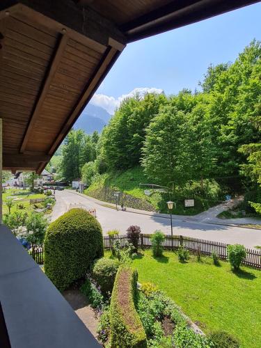 a view of a park with bushes and a fence at Ferienhaus Am Brücklesbach in Grainau