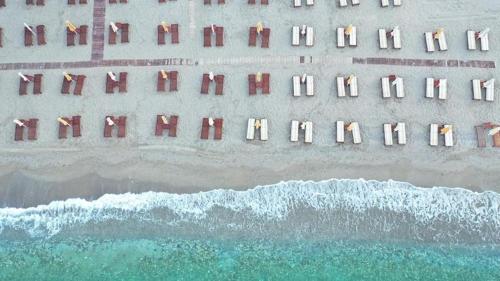 an overhead view of the beach with the ocean at Konstantinos Palace in Karpathos Town
