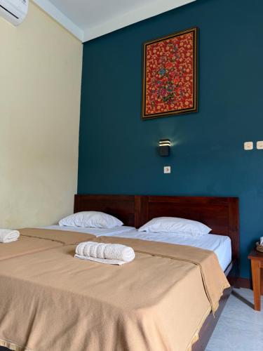 Postel nebo postele na pokoji v ubytování Watukarung Kaderi's Home