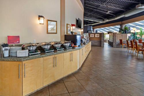 a kitchen with pots and pans on a counter at Best Western PLUS Mirage Hotel and Resort in High Level