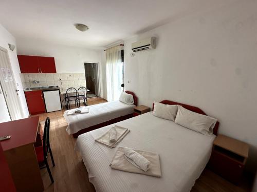 Postel nebo postele na pokoji v ubytování Guesthouse Apartments