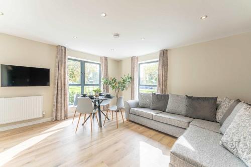 a living room with a couch and a table at Maple Apartments - Modern 2 Bed Apartment in Derby in Derby