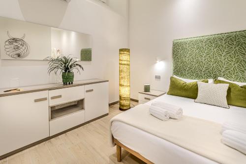 Un ou plusieurs lits dans un hébergement de l'établissement Artis Rooms Guesthouse
