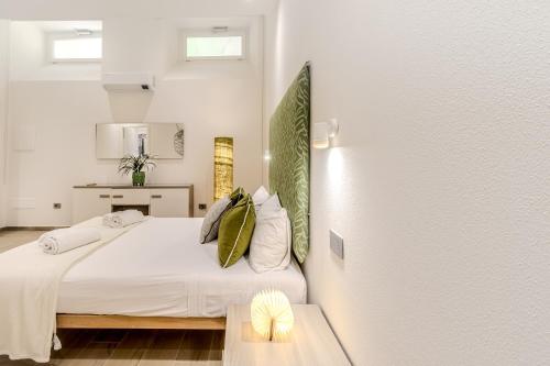 Un ou plusieurs lits dans un hébergement de l'établissement Artis Rooms Guesthouse