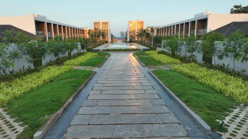 a walkway in the courtyard of a building at The Shore Trishvam in Puducherry